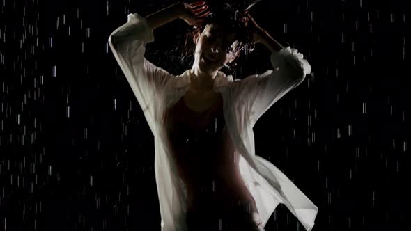 Beautiful Woman Dancing In The Rain