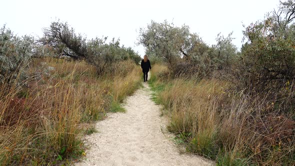 The Girl Goes on a Footpath