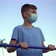 A Teenage Boy in a Medical Mask Is Engaged in Sports - VideoHive Item for Sale