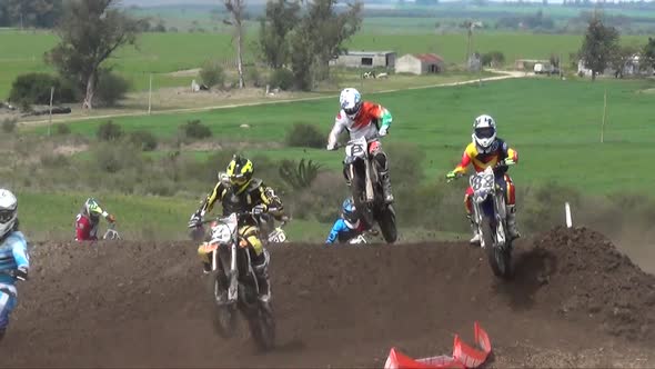 Men racing in a motocross motor sports race.