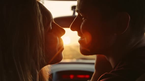 Young Fun Hippie Lovers Hugging and Kissing on Sunset