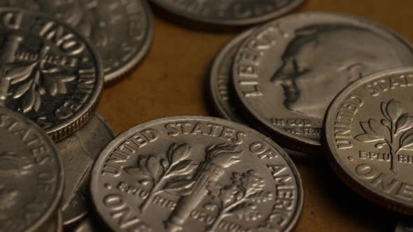Rotating stock footage shot of American dimes (coin - $0.10)