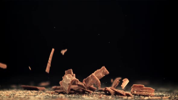 Super Slow Motion Falling of Grated Milk Chocolate