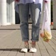 Unrecognizable woman walking with eco bag filled with fruits. Eco friendly, reusable shopping bag - VideoHive Item for Sale