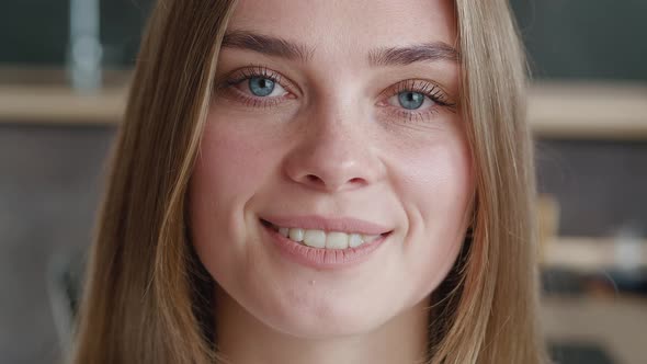 Close-up Smiling Young European Woman Model Looking at Camera at Home. Portrait If Beautiful Female