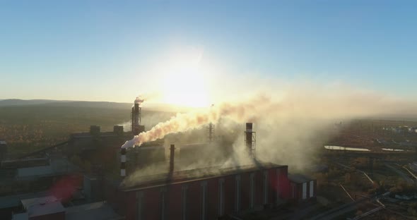 Aerial Drone Footage of Steel Factory Chimneys During Sunset Time Aerial 4K