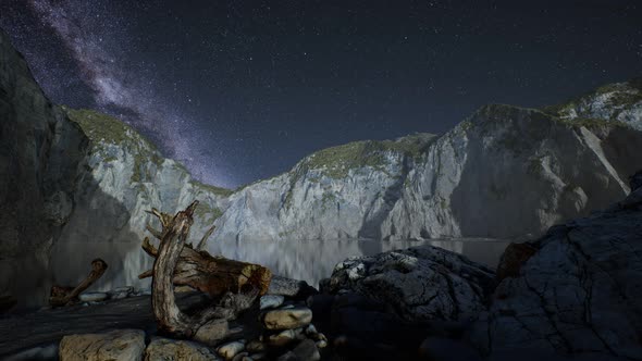 Hyperlapse of Night Starry Sky with Mountain and Ocean Beach in Lofoten Norway