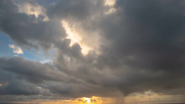 Time Lapse Golden Sunset In Cloudy Sky.