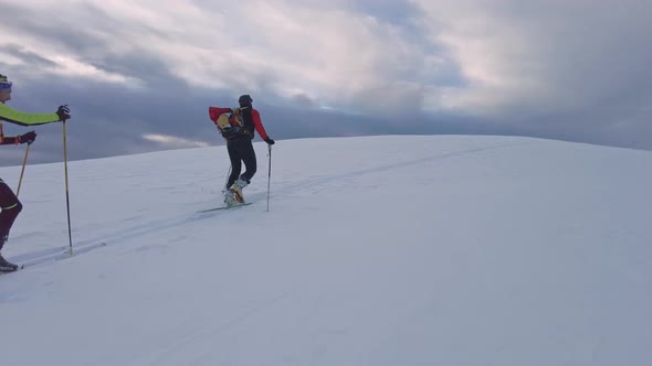 Ski Mountaineering Couple Uphill