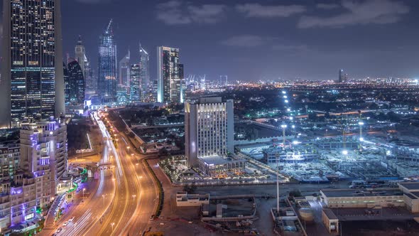 Construction Activity in Dubai Downtown with Cranes and Workers Night Timelapse UAE