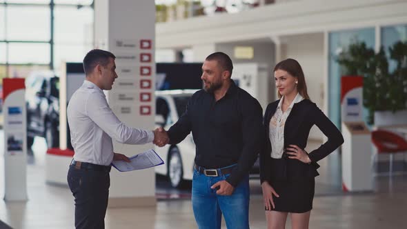 Couple in Car Dealership