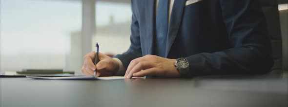 Businessman Signing a Contract