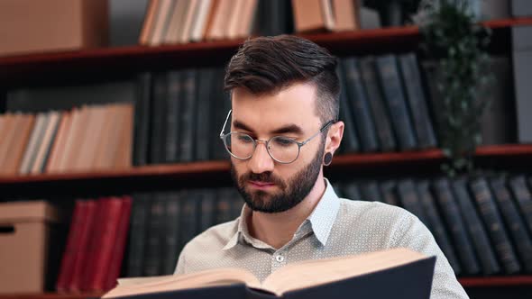 Pensive Academic Student Teacher Hipster Man Learning Vintage Paper Book Library Cupboard Closeup