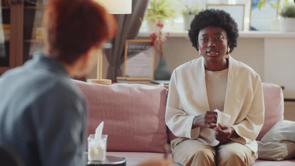 Upset Black Woman Speaking with Counseling Psychologist