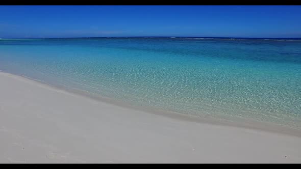 Aerial drone abstract of idyllic island beach vacation by turquoise ocean with white sandy backgroun