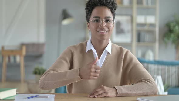 Happy Cheerful African Girl Showing Thumb Up