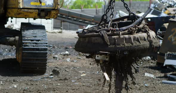 Excavator machine being operated in the junkyard 4k