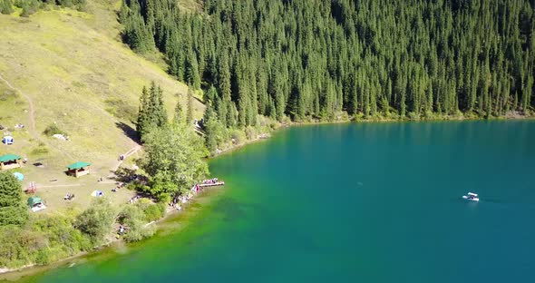 Kolsay Lake Among Green Hills and Mountains.