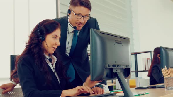 Business People Wearing Headset Working in Office