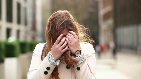 Portrait of a beautiful woman with hair tousled by the wind