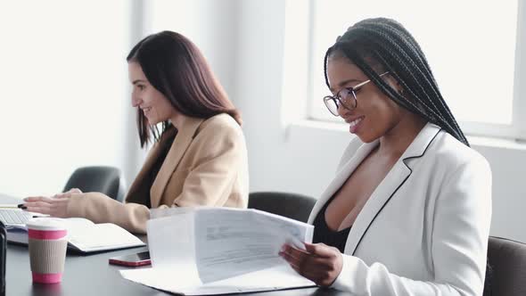 Business Multi Racial Women Working in the Office