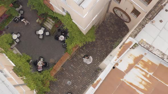 Newlyweds Aerial View Groom Bride Walking Dancing Kissing on City Street Wedding Couple in Love