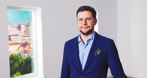 Close Up Portrait of Happy Handsome Young Caucasian Male Real Estate Agency Worker in Suit