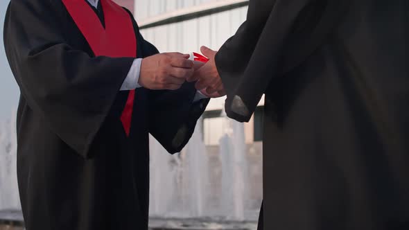 Graduation Ceremony Senior Lecturer Presents a Diploma to a University Graduate a Solemn Moment