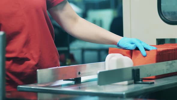 Plant Worker Is Removing Paper Tissues From the Conveyor