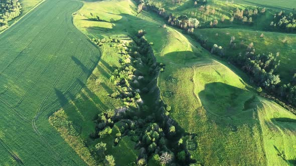 Aerial View of Beautiful Landscape with Hills and Green Field