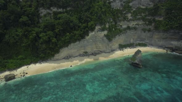 Aerial view of virgin Suwehan beach, Nusa Penida island, Indonesia, Zoom in