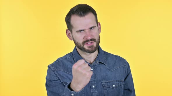 Disappointed Beard Young Man Feeling Angry, Yellow Background