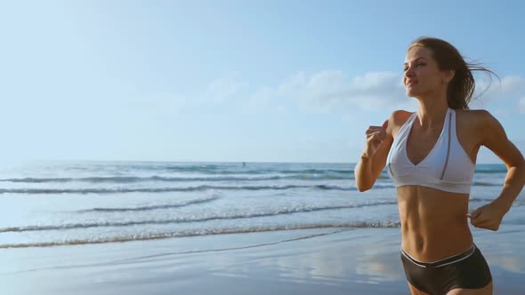 Woman Athlete Silhouette Running on Beach Sprinting Waves Crashing on Seaside Morning Background