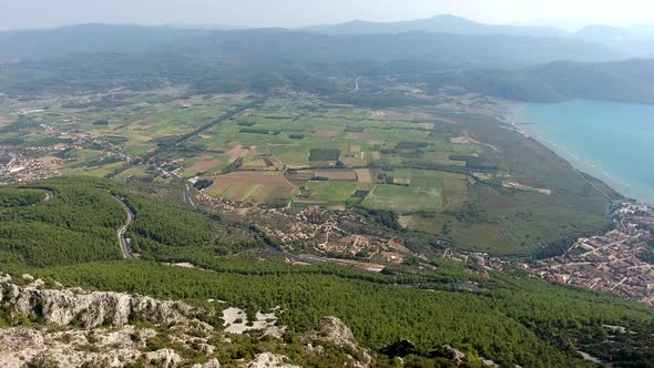 A Small City on a Forested Bay and Fertile Alluvial Plain by the Sea