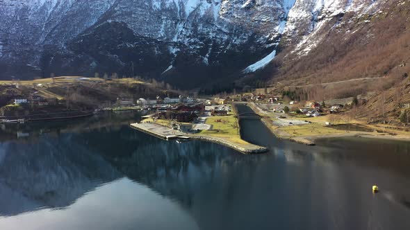 Flam village aerial overview - Ascending aerial with tilt down during sunny spring morning