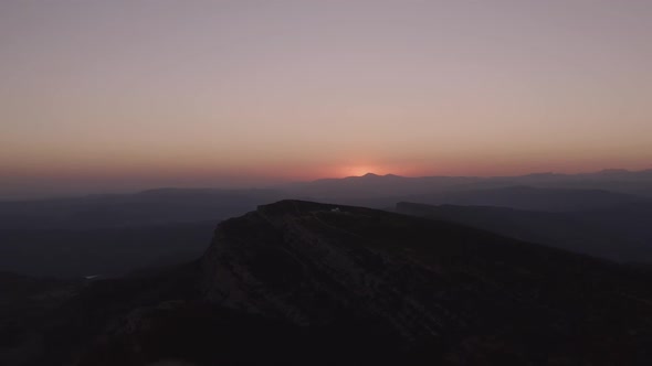 Sunset sky over mountain ridge in highland