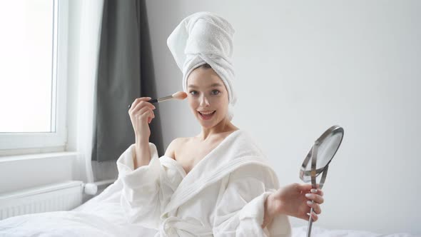 Morning Routine of Young Woman Holding Mirror in Hands and Look at It