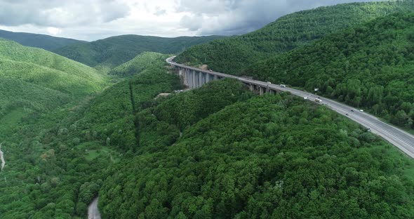 Aerial view of highway and beautiful natural landscape. Mountain bridge.