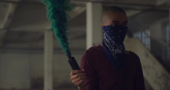 Fashionable young man in an abandoned warehouse