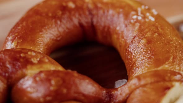 Putting Fresh Pretzels on Table Top View