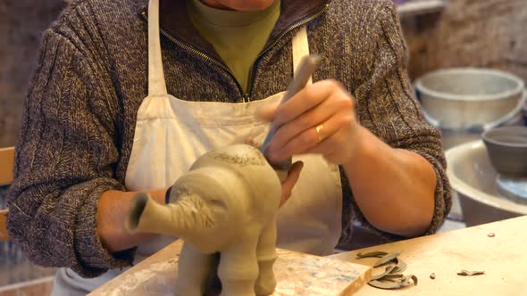 Potter working on clay sculpture