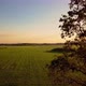 Aerial Cinematic Clip Drone Flying Over a Farm Field During Sunset - VideoHive Item for Sale