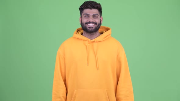 Happy Young Overweight Bearded Indian Man Smiling