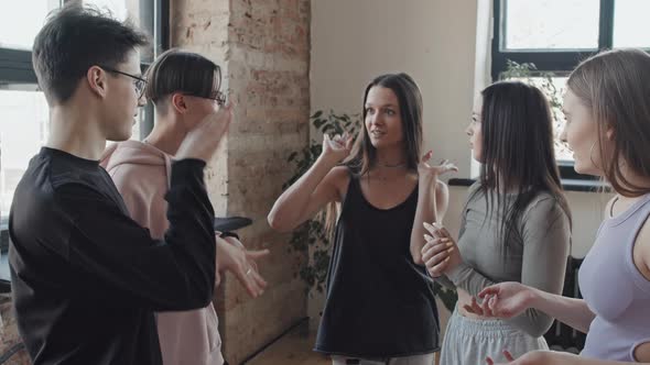 Young Friends Chatting in Dance Studio