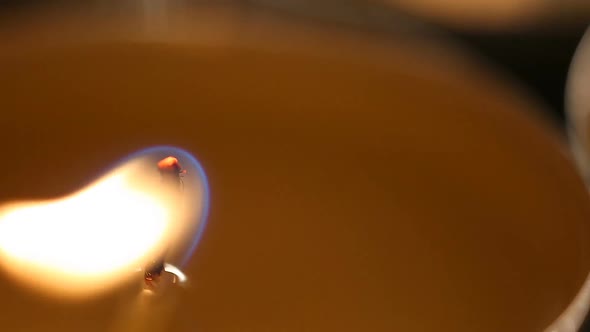 Candle Flame Burning Calmly at Religious Service in Church, Light in Darkness