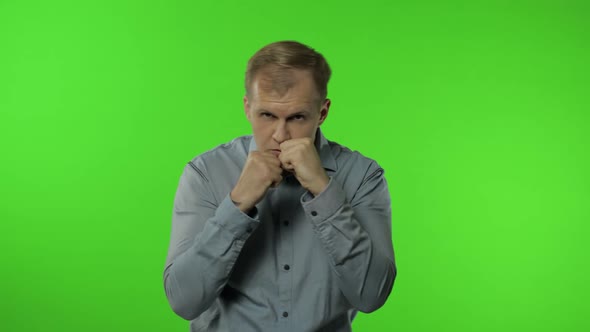 Funny Handsome Guy Trying To Fight at Camera, Boxing with Expression. Man on Chroma Key Background