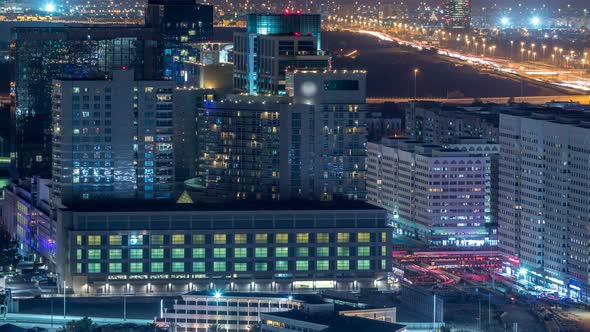 Aerial Skyline of Abu Dhabi City Centre From Above Night Timelapse