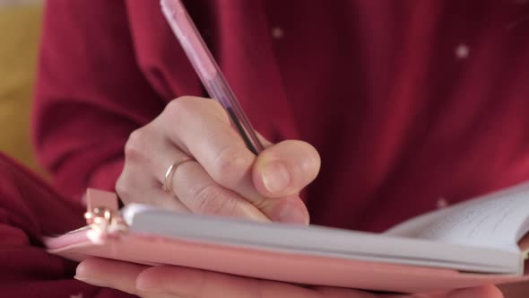 Woman Writing in Diary