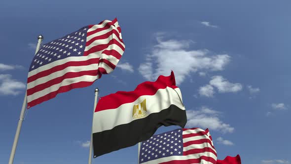 Flags of Egypt and the USA Against Blue Sky