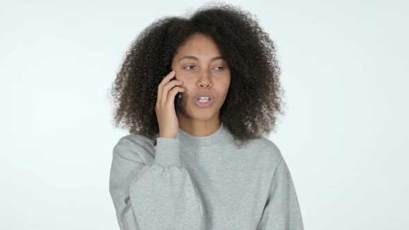 African Woman Talking on Smartphone White Background